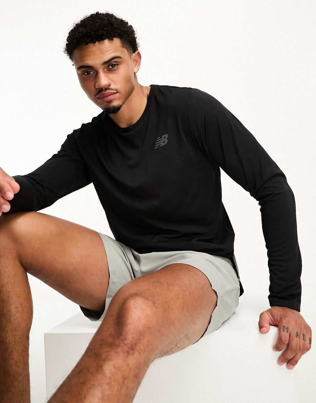 

Черный жаккардовый топ с длинными рукавами New Balance Q Speed