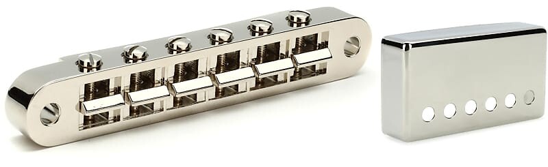 

Аксессуары Gibson Бридж Nashville Tune-O-Matic с полной сборкой - Никелевый комплект с аксессуарами Gibson Положение грифа Крышка хамбакера - Никель Gibson Accessories PBBR-045=1 PRPC-030=1
