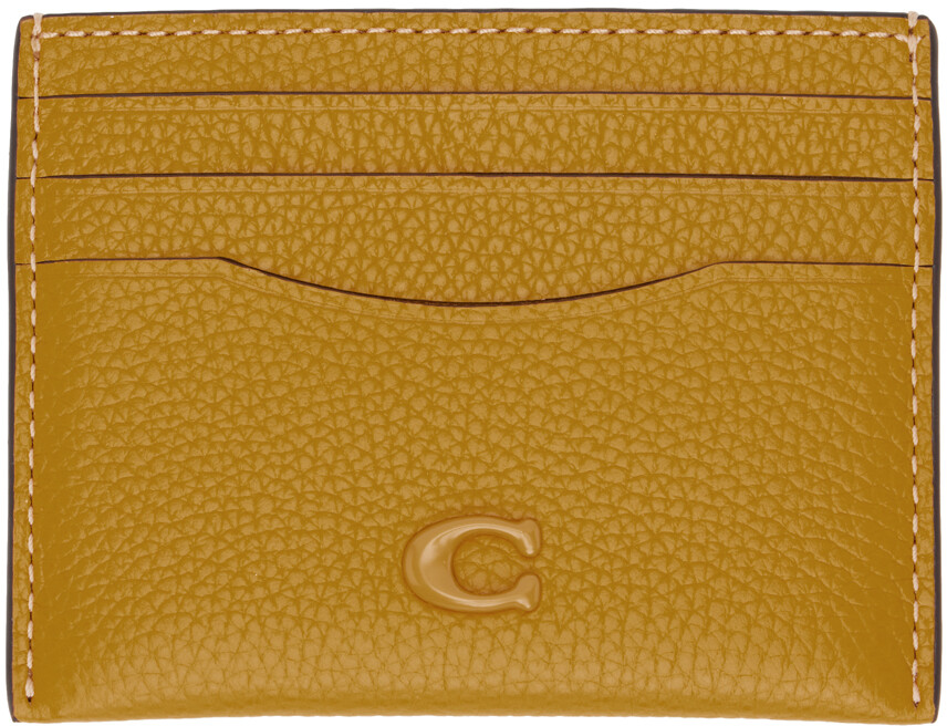 

Желтая визитница с логотипом Coach 1941
