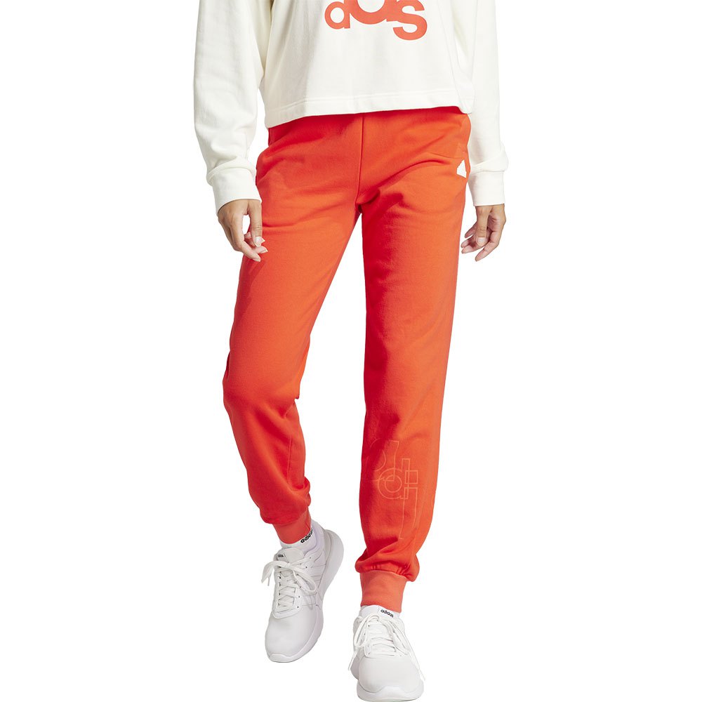 цена Брюки adidas Brand Love, оранжевый