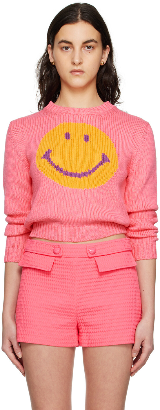 

Розовый свитер со смайликами Moschino