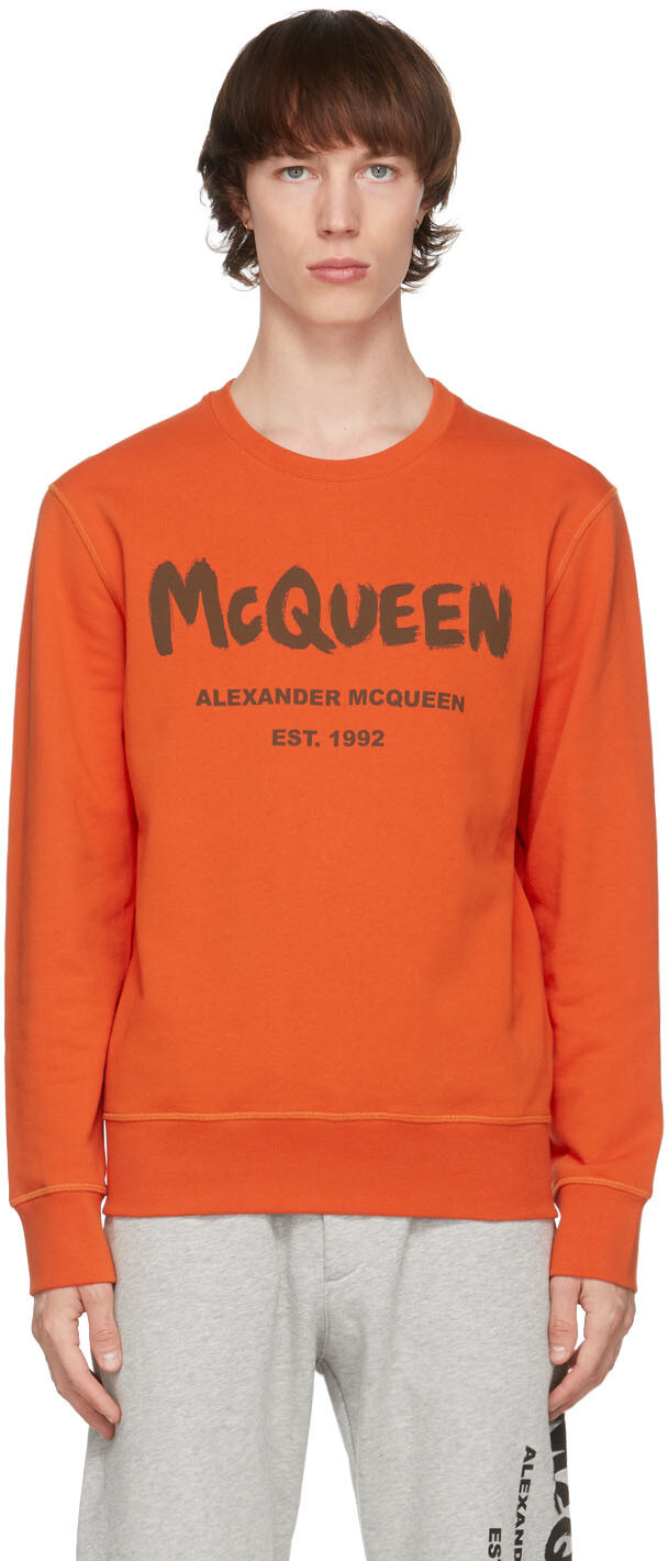 

Оранжевая толстовка с граффити Alexander McQueen