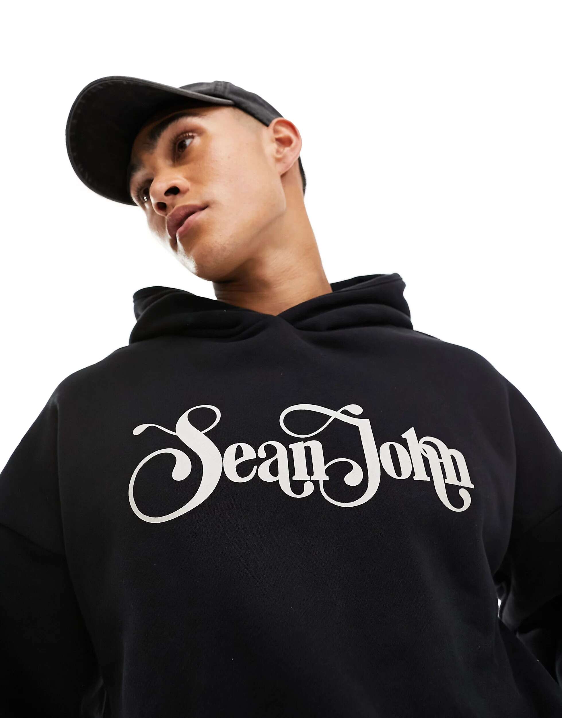 Черный пуловер в стиле ретро с логотипом Sean John бежевый свитшот в стиле ретро с принтом на груди и спине sean john