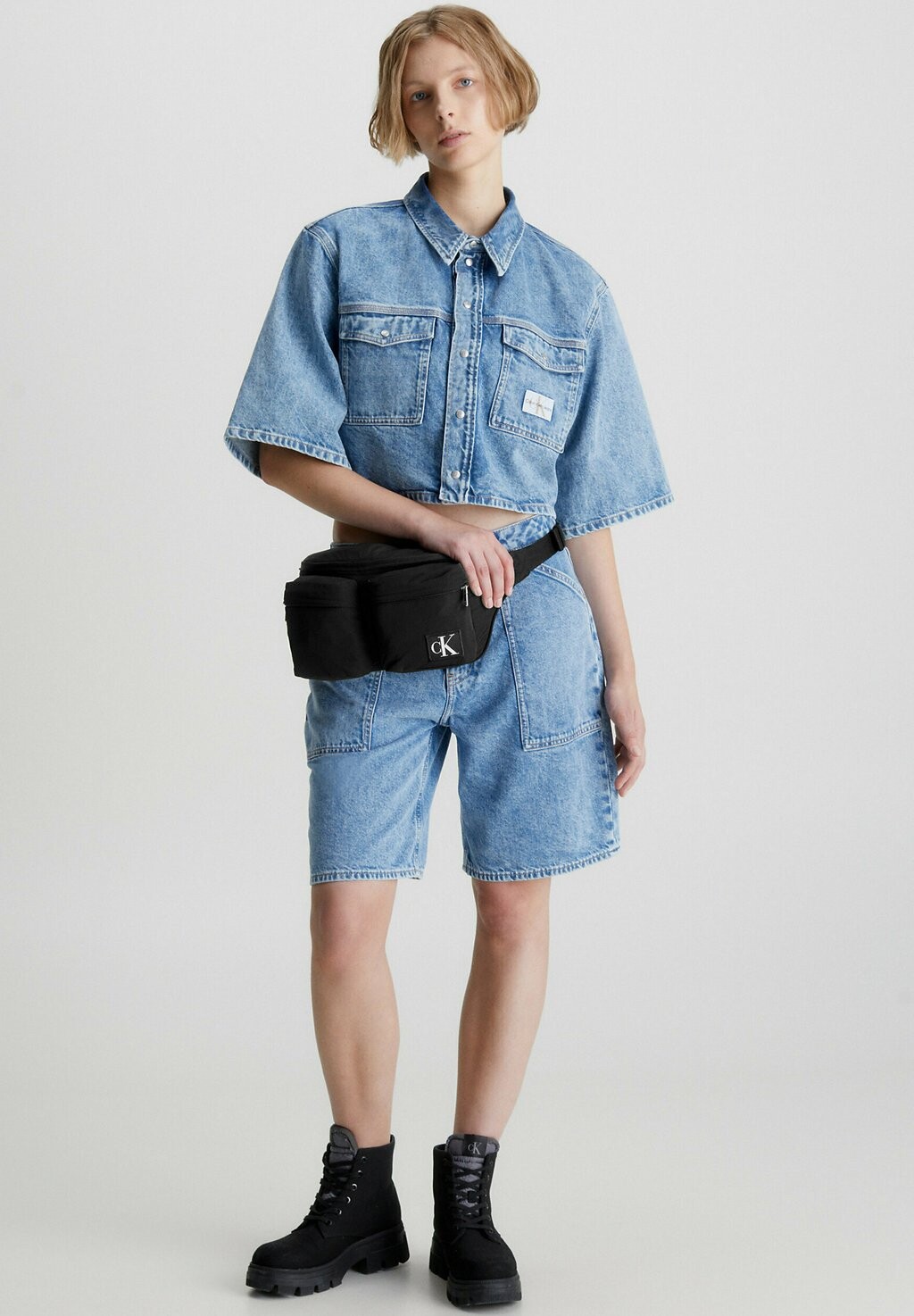 

Сумка на пояс Calvin Klein Jeans, черный