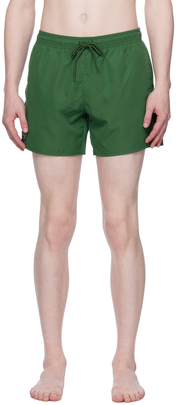 

Зеленые плавки с нашивкой Lacoste