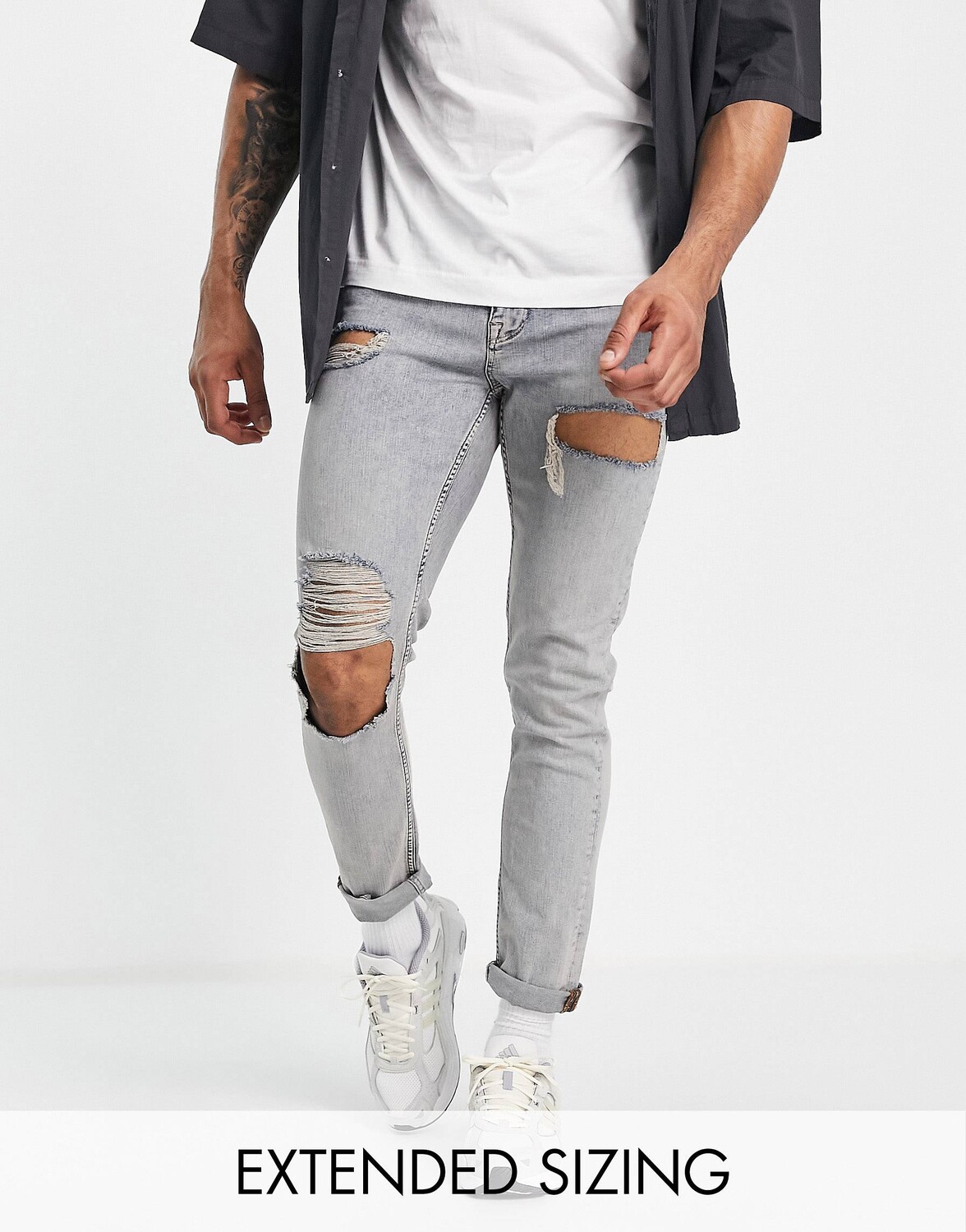 

Джинсы скинни ASOS DESIGN средней степени потертости с прорезями на бедрах