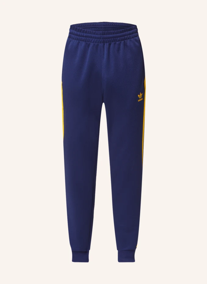 

Спортивные брюки adicolor classics+ sst с галлонными полосками Adidas, синий