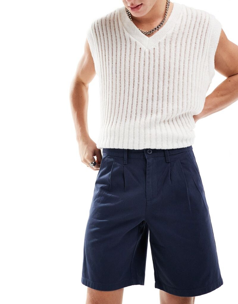 

Темно-синие шорты чинос с двойными складками ASOS DESIGN