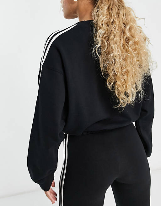 

Черный свитшот adidas Sportswear Essentials