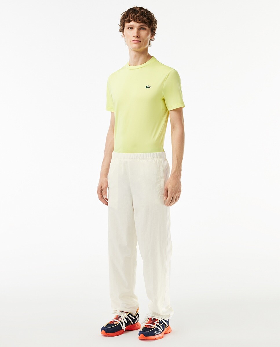

Спортивные брюки свободного кроя с полосками Lacoste, белый