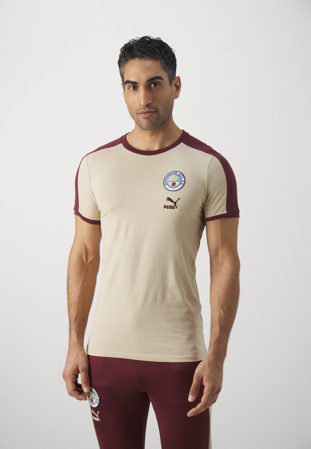 

Футболка с символикой MANCHESTER CITY FTBLHERITAGE TEE Puma, цвет granola/aubergine