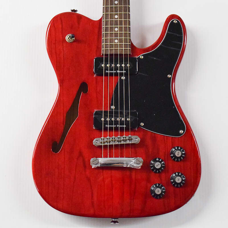 

Полуакустическая электрогитара Fender Jim Adkins JA-90 Telecaster Thinline — темно-красная прозрачная с накладкой из индийского лавра Jim Adkins JA-90 Telecaster Thinline Semi-hollowbody Electric Guitar