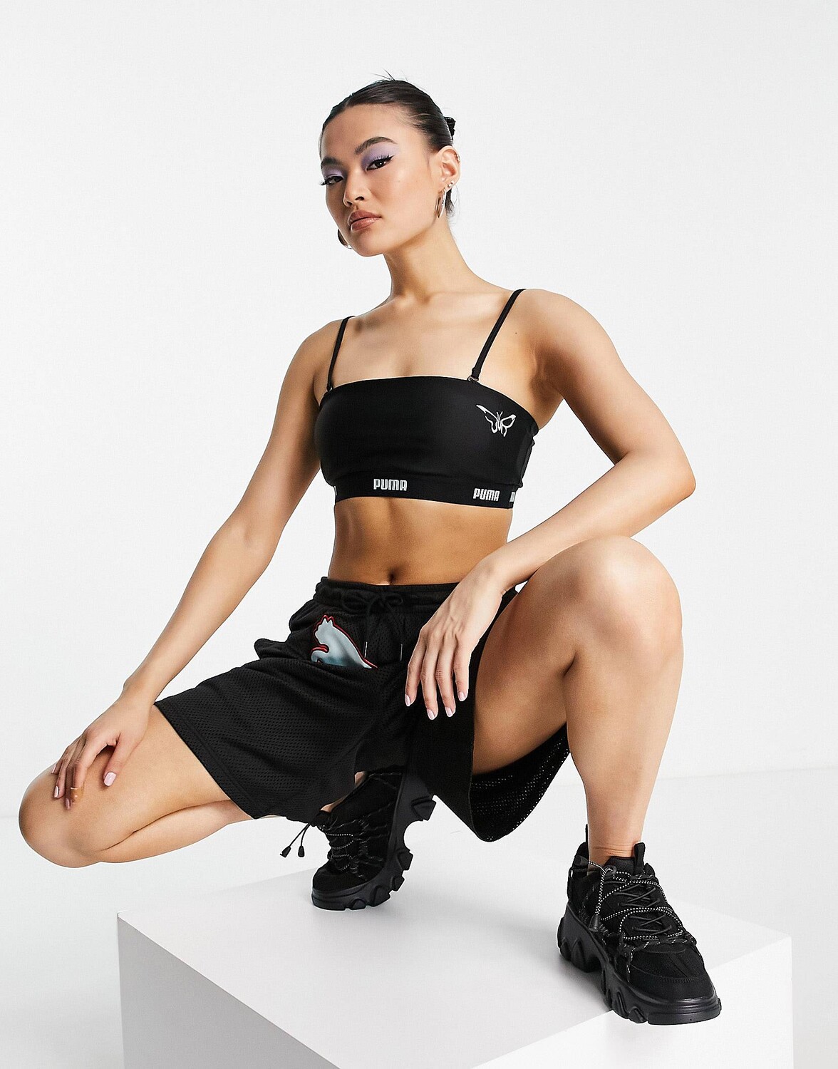 

Черный бюстгальтер PUMA x DUA LIPA