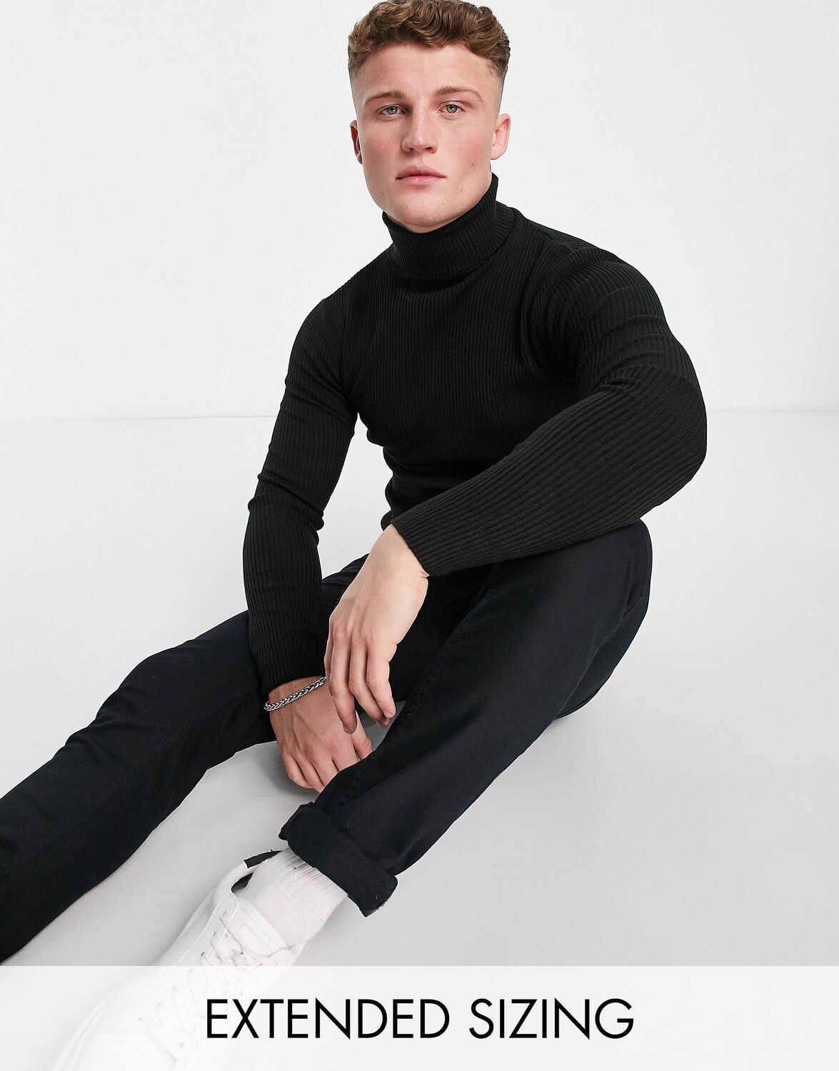 

Черный трикотажный джемпер в рубчик с высоким воротником ASOS DESIGN