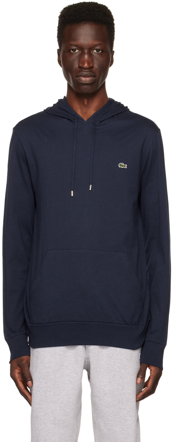 

Худи темно-синего цвета с нашивками Lacoste