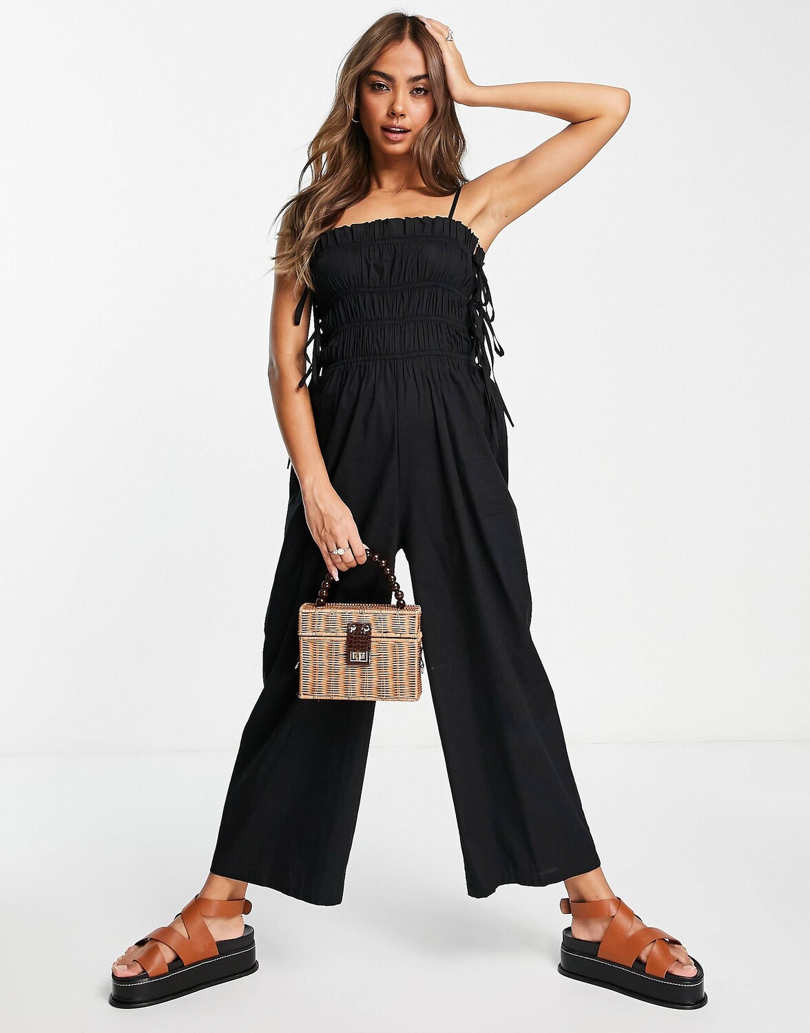 

Черный присборенный комбинезон с завязками на боках ASOS DESIGN