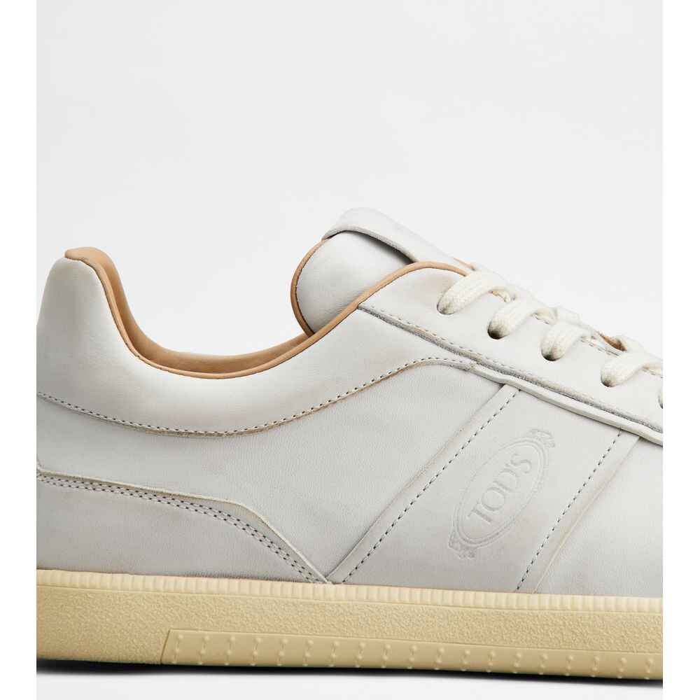 

Кожаные кроссовки Tod's Tabs, цвет Yogurt