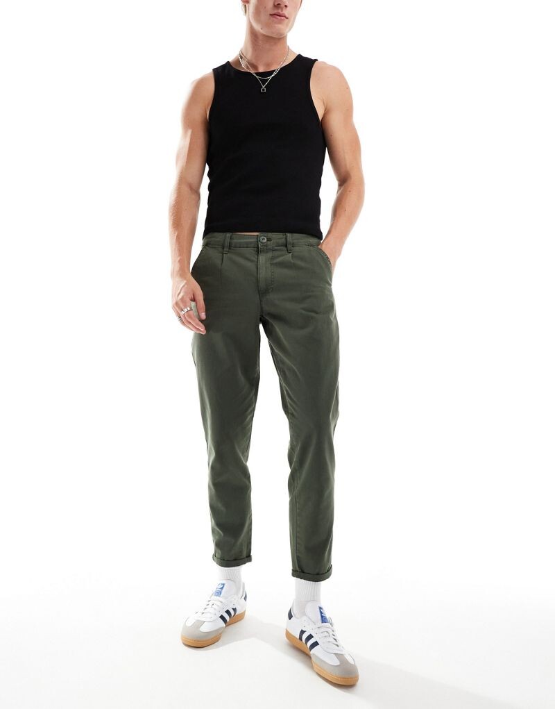 

Классические жесткие потертые чиносы цвета хаки ASOS DESIGN
