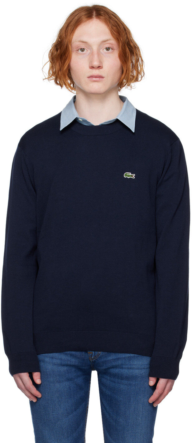 

Темно-синий свитер с нашивками Lacoste