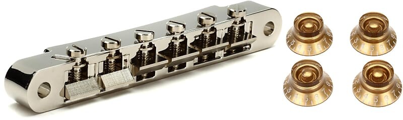 

Аксессуары Gibson ABR-1 Tune-O-Matic Бридж в полной сборке - никелевый комплект с аксессуарами Gibson Top Hat Knobs 4 шт. - винтажное золото Gibson Accessories PBBR-015=1 PRHK-020=1