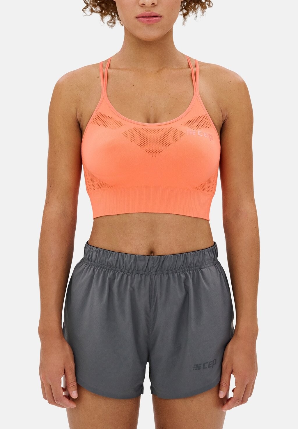

Спортивный бюстгальтер с легкой поддержкой ULTRALIGHT SPORTS BRA SEAMLESS WOMEN CEP, цвет coral