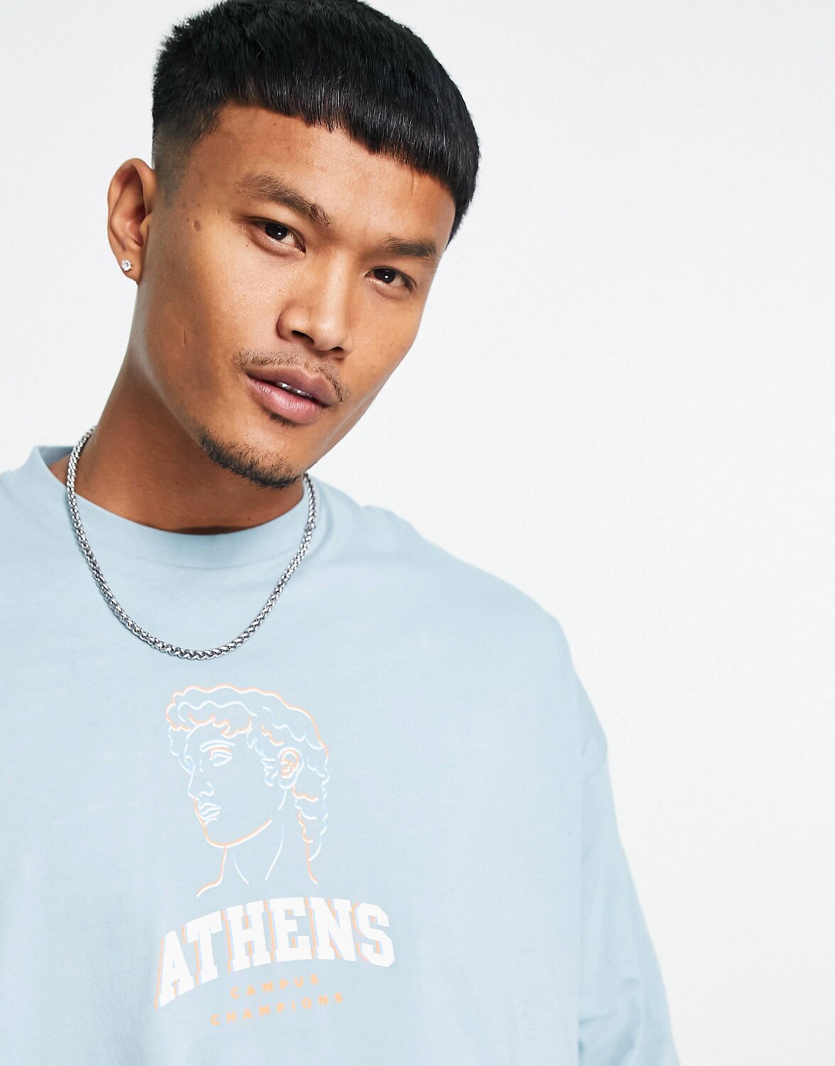 

Синяя футболка оверсайз с принтом спереди ASOS DESIGN