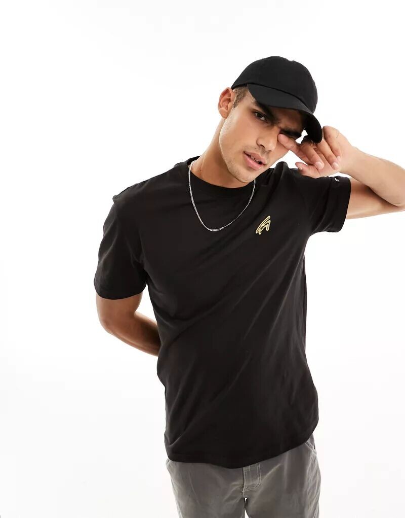 

Черная футболка Tommy Jeans с фирменным золотым логотипом