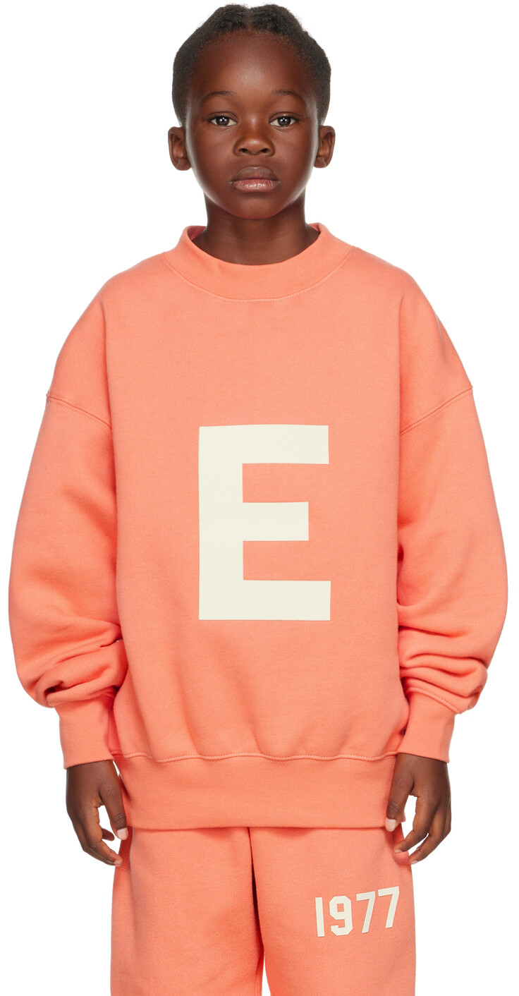 

Детский розовый свитшот с логотипом Fear of God ESSENTIALS