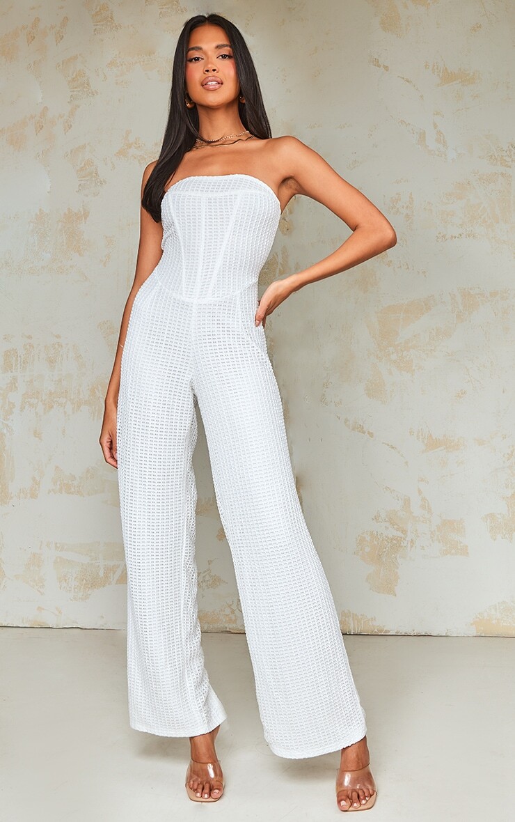 

PrettyLittleThing Кремовый текстурированный комбинезон с корсетом и кольцами в рубчик