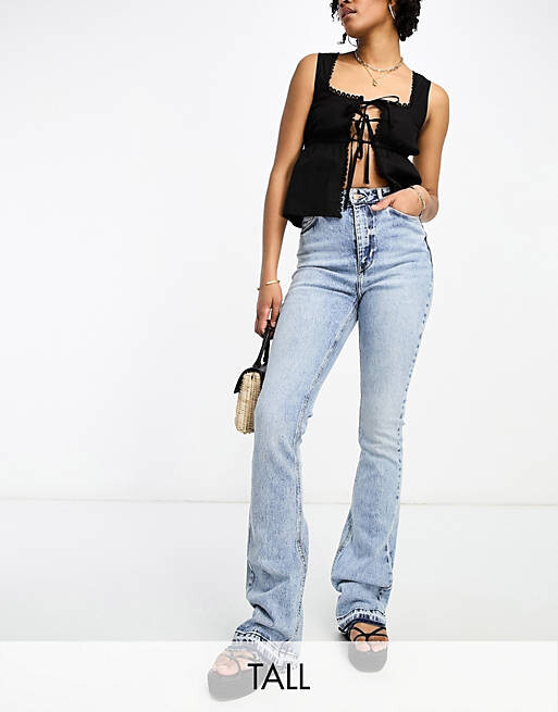 

Синие расклешенные джинсы с отделкой по нижнему краю New Look Tall