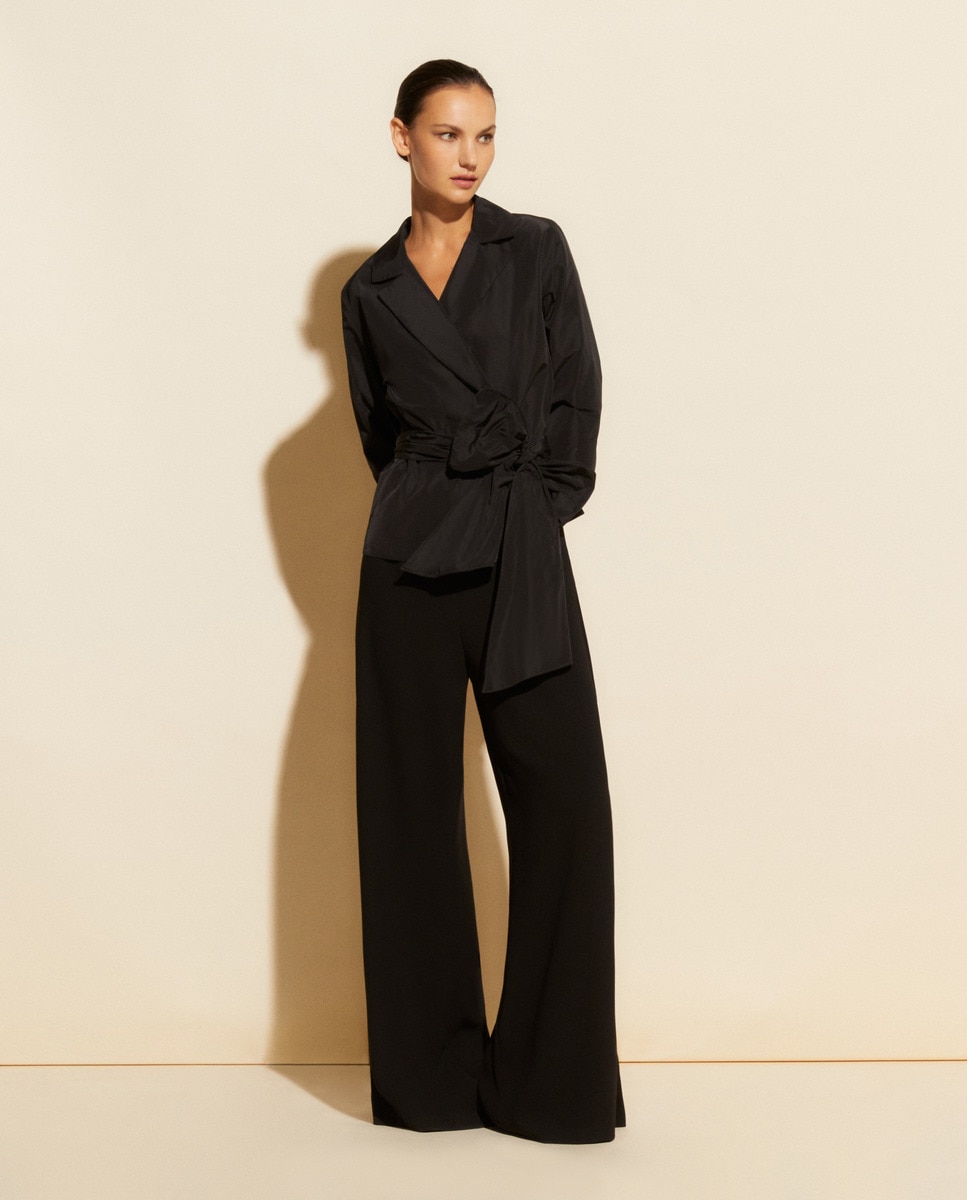 цена Однотонные и широкие женские брюки El Corte Inglés, черный