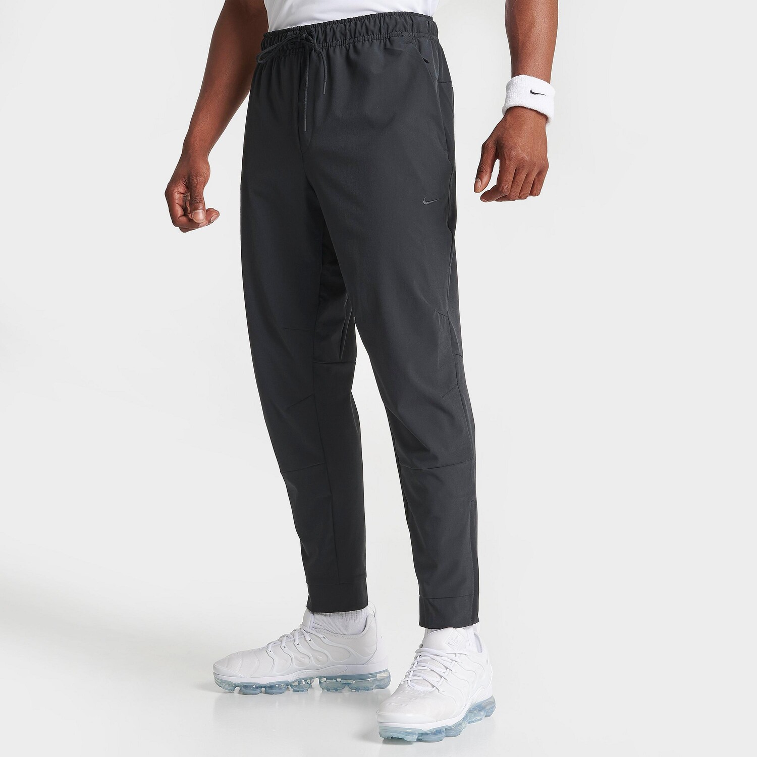 

Мужские универсальные тренировочные брюки с зауженной кромкой Nike Dri-FIT Unlimited, черный