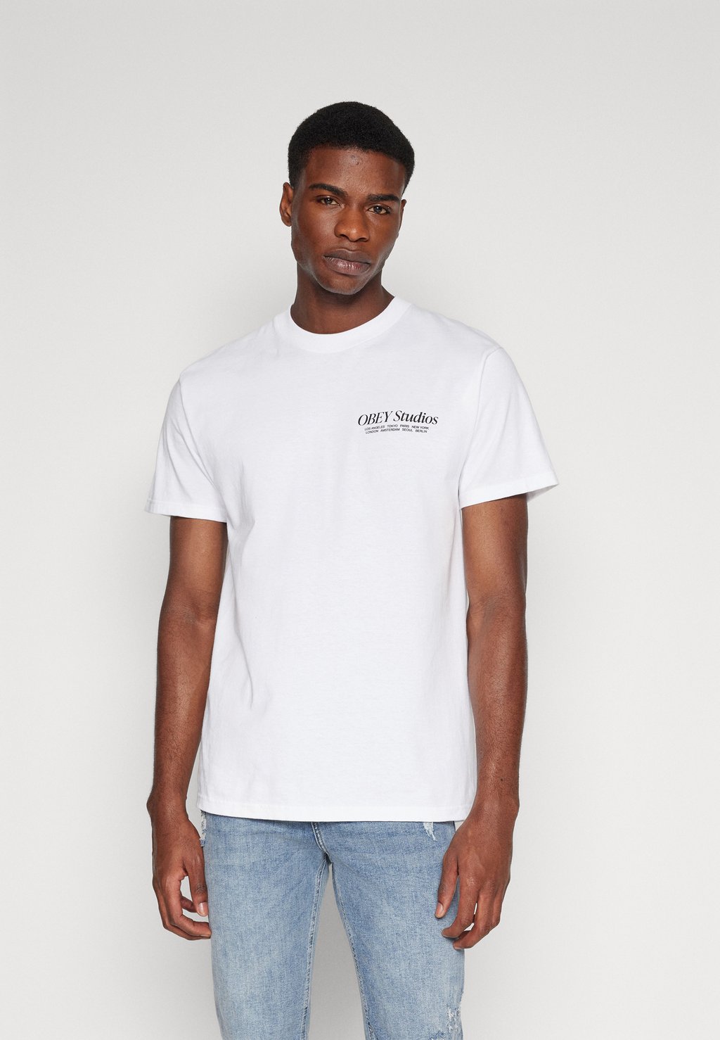 Футболка с принтом Studios Unisex Obey Clothing, белый футболка с принтом nothing unisex obey clothing цвет vintage black