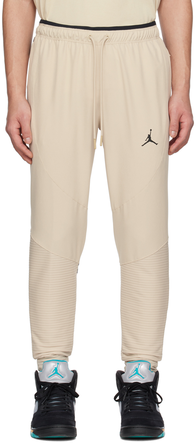 Бежевые спортивные штаны со вставками Nike Jordan спортивные штаны nike jordan flight бежевый