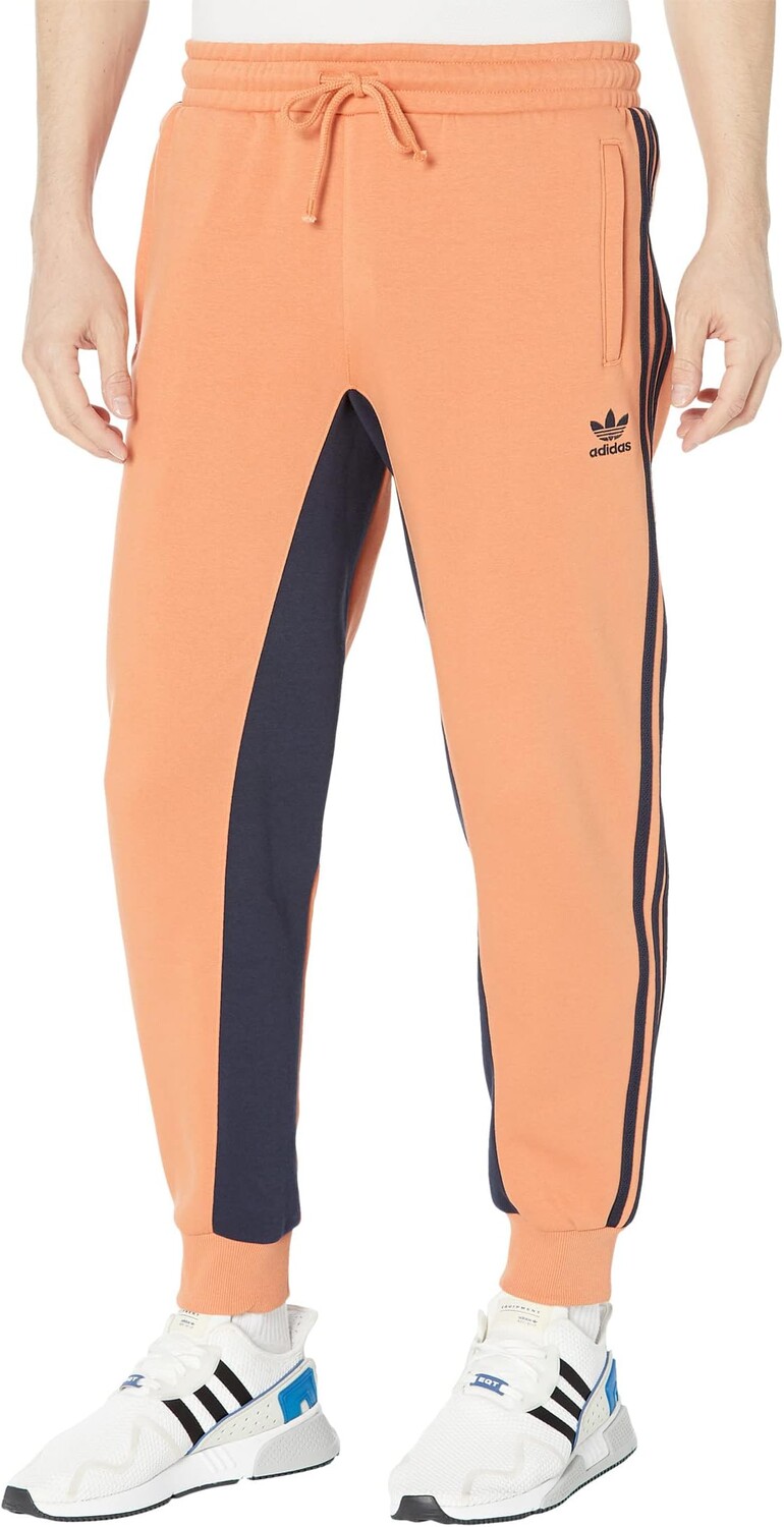 

Флисовые спортивные брюки Superstar adidas, цвет Hazy Copper/Legend Ink