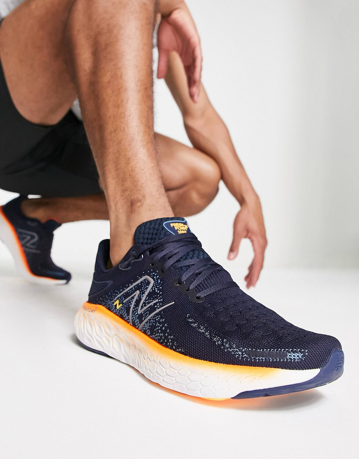 

Темно-синие и оранжевые кроссовки New Balance Running Fresh Foam X 1080v12