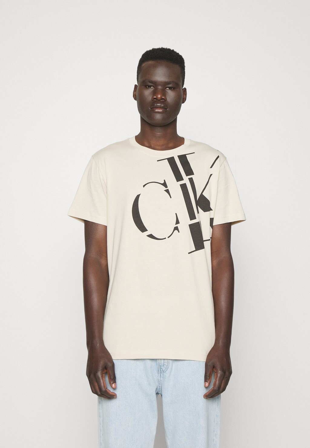 

Футболка с принтом Calvin Klein Jeans, бежевый