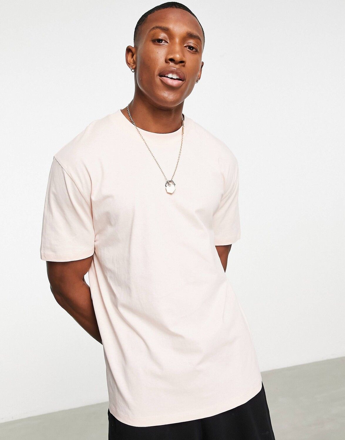 

Светло-розовая футболка свободного кроя ASOS DESIGN