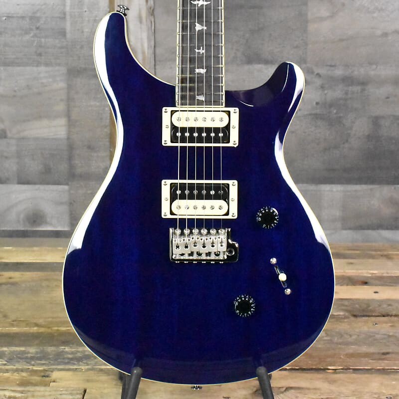 

Paul Reed Smith SE Standard 24 — полупрозрачный синий с сумкой для переноски, серийный номер: 3205 PRS Paul Reed Smith SE 24 - Translucent with Gig Bag SN:3205