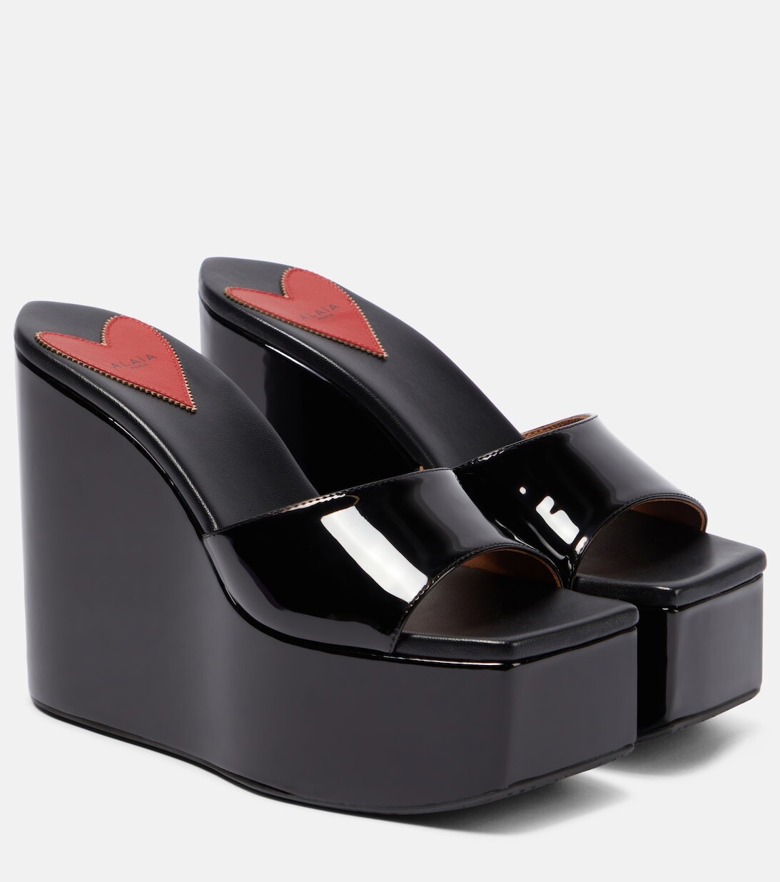 

Мюли из лакированной кожи на танкетке Alaïa, черный