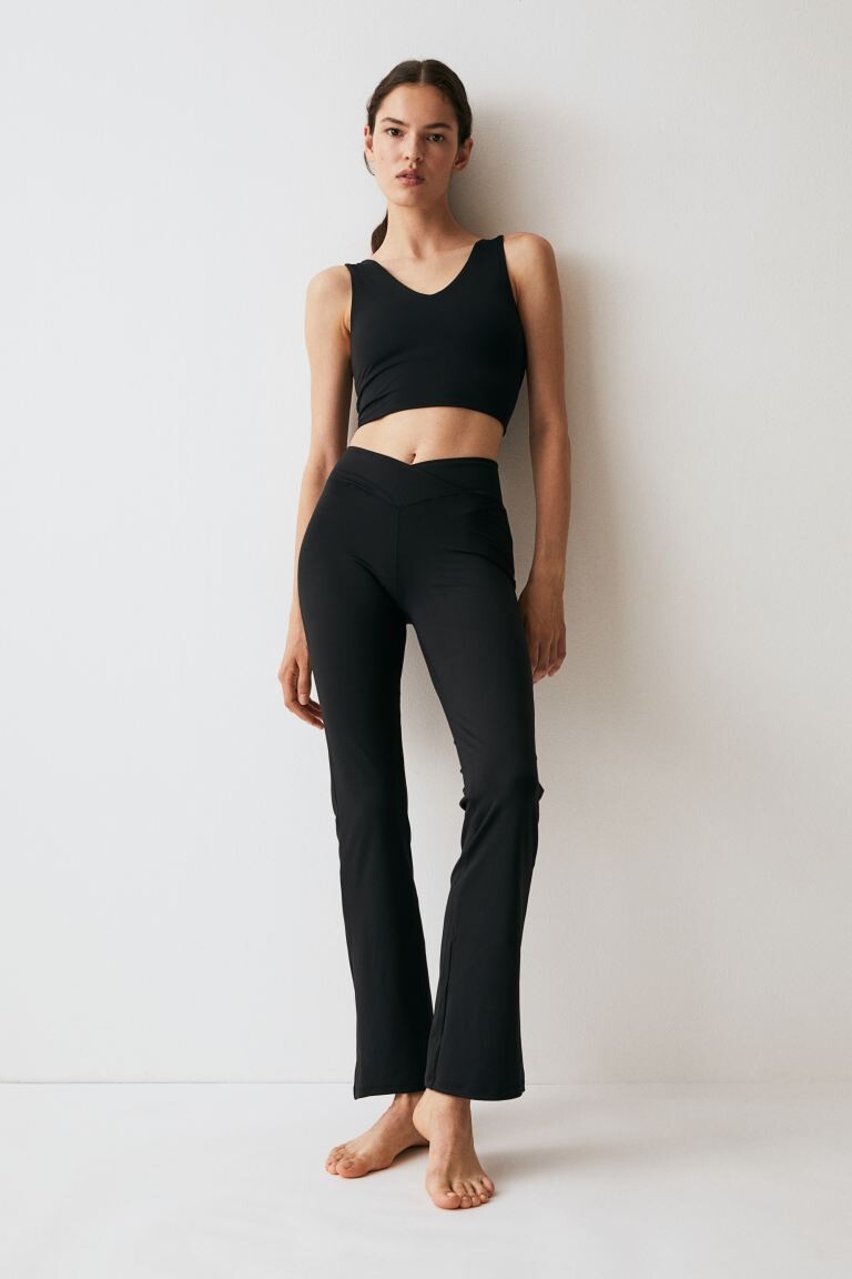 

Спортивные тайтсы SoftMove с расклешенными штанинами H&M