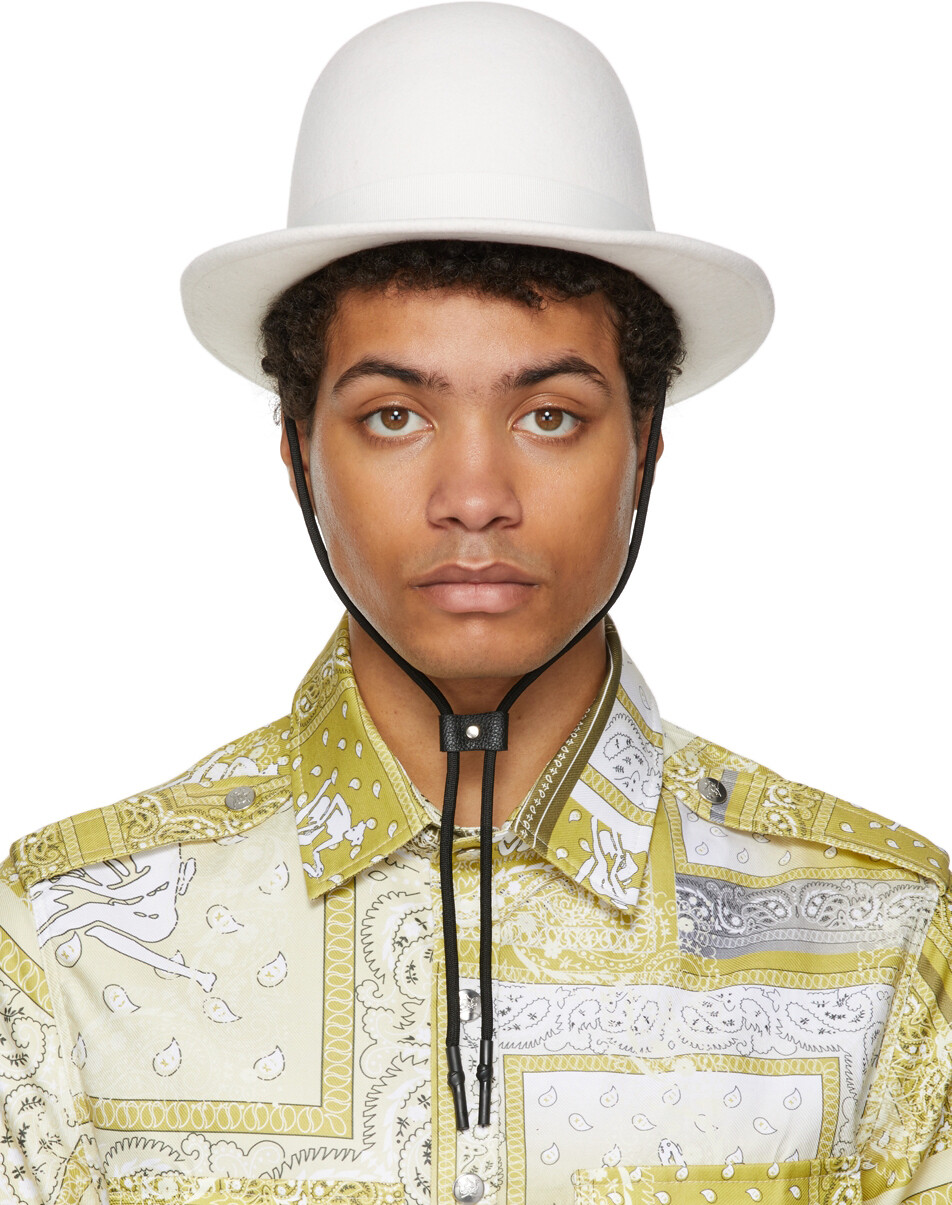 

Белая шляпа банкира THEBE MAGUGU