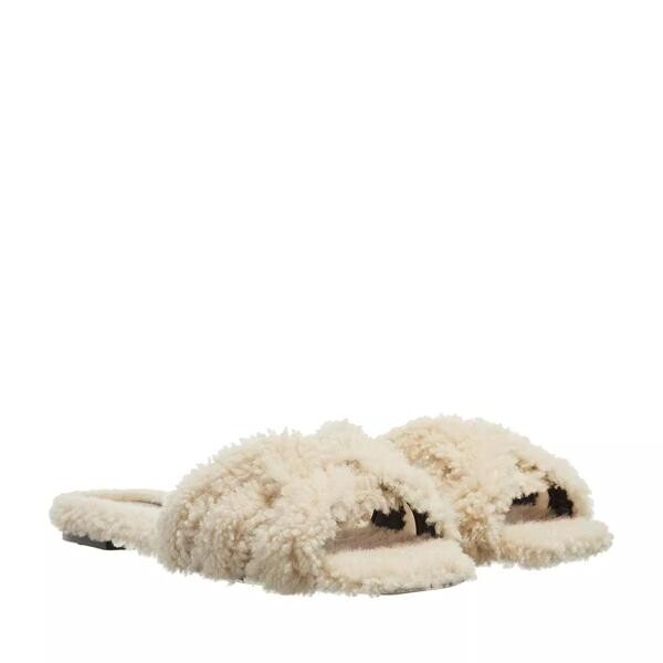

Тапочки tribute flat mules shearling Saint Laurent, бежевый