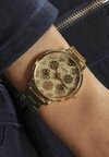 

Часы Guess, золотой