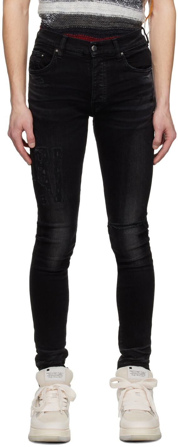 

Черные рваные джинсы AMIRI