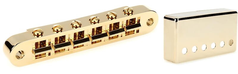 

Аксессуары Gibson Бридж Nashville Tune-O-Matic с полной сборкой - Золотой комплект с аксессуарами Gibson Позиция бриджа Крышка хамбакера - Золото Gibson Accessories PBBR-040=1 PRPC-025=1