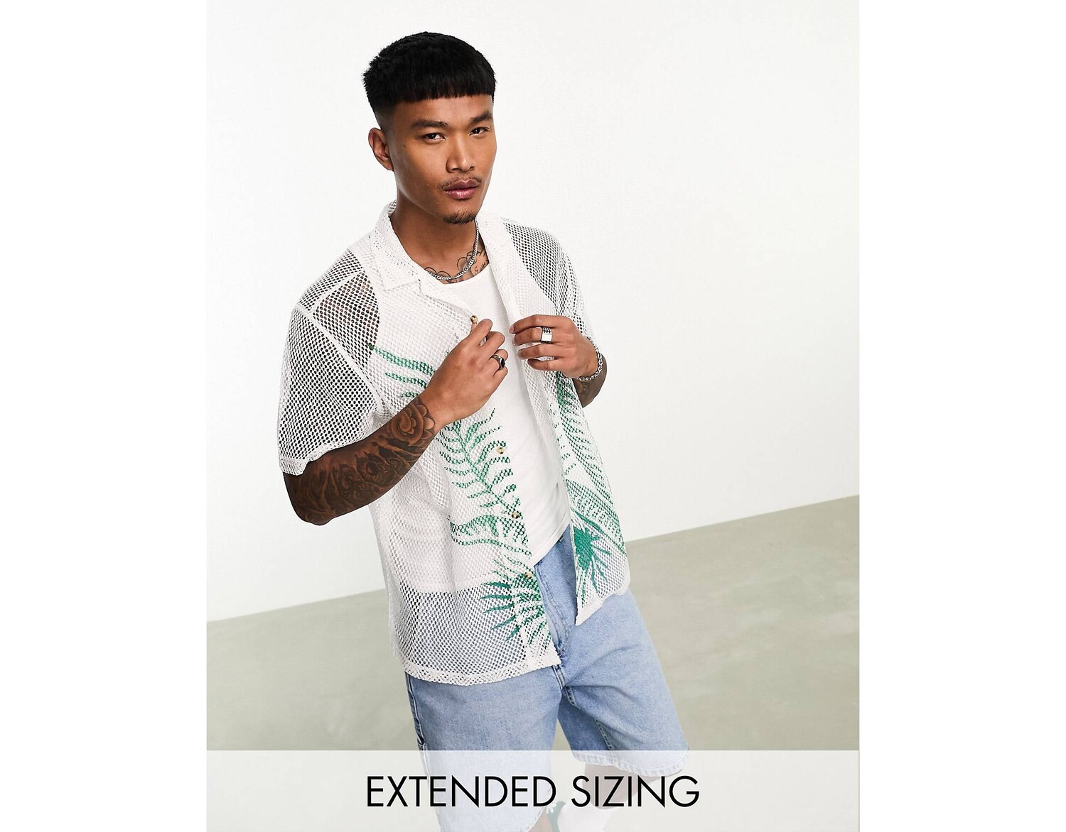 

Сетчатая рубашка свободного кроя с принтом в виде ладоней ASOS DESIGN