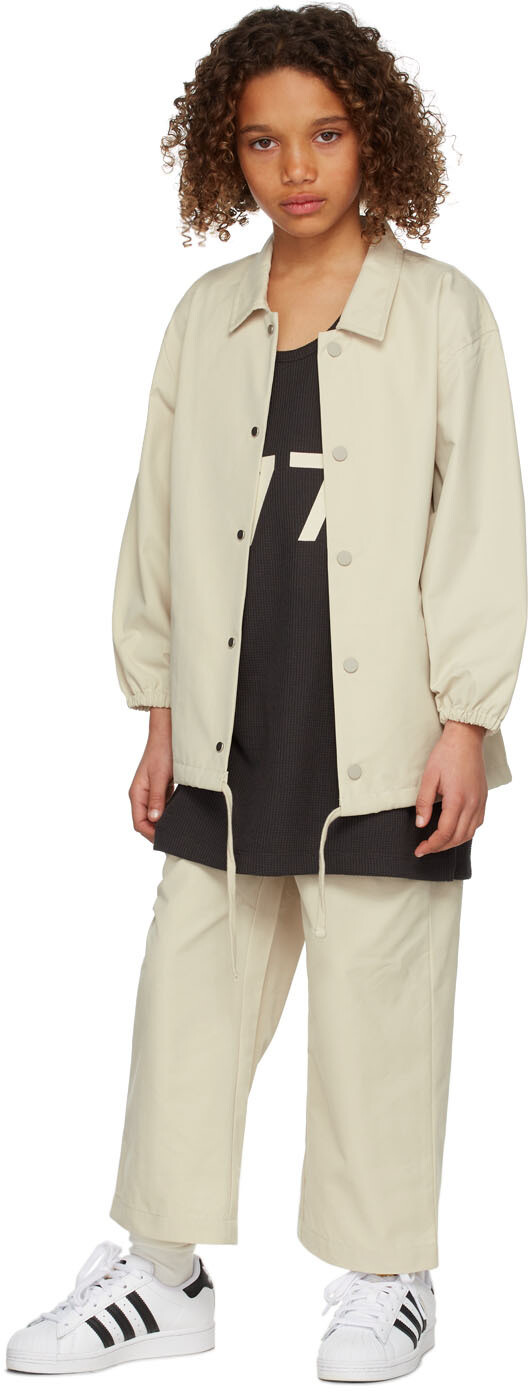 

Детская бежевая спортивная куртка Fear of God ESSENTIALS