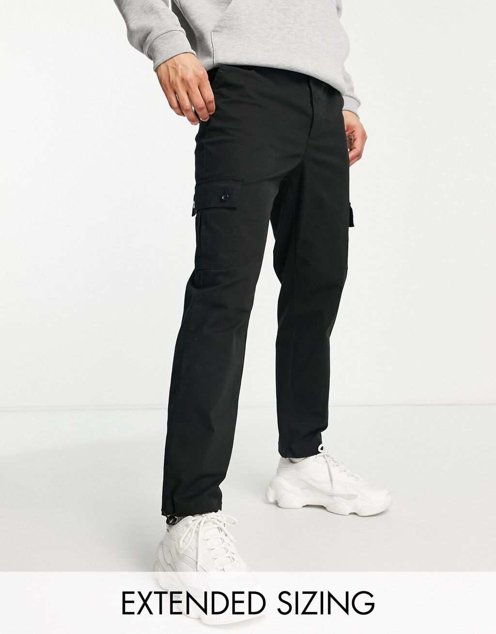

Черные зауженные брюки карго с застежками ASOS DESIGN