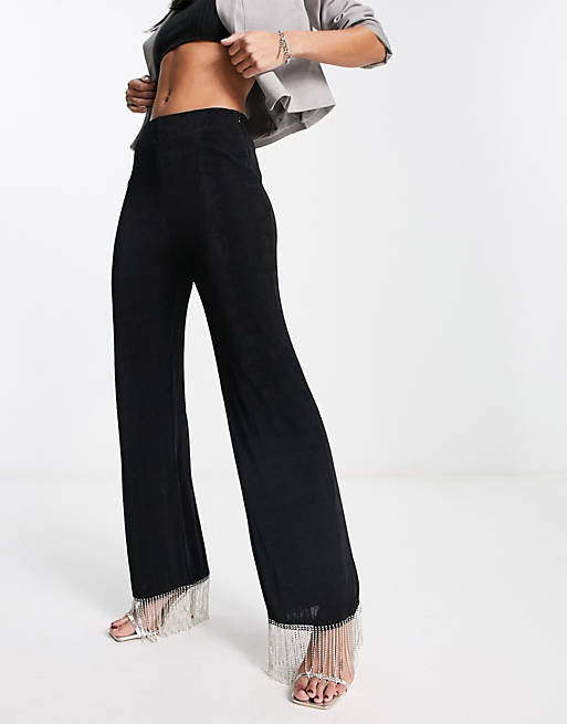 Черные блестящие брюки NA-KD x Mimi AR с бахромой